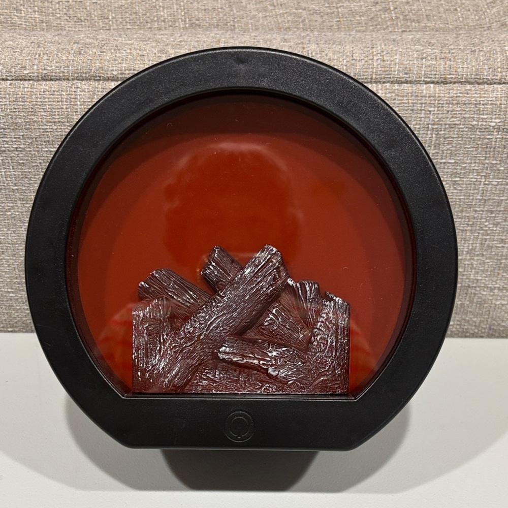 Black Circular faux electric fireplace